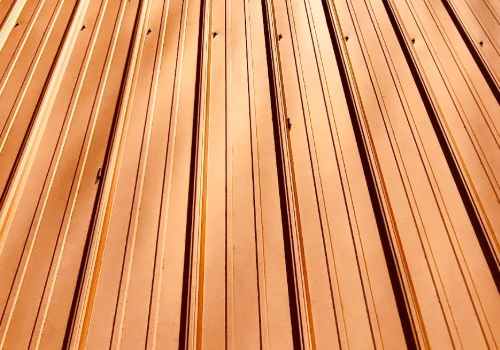Copper Roofing Expertise by Story Roofing Textured close-up of a copper roof highlighting the unique patina and craftsmanship.